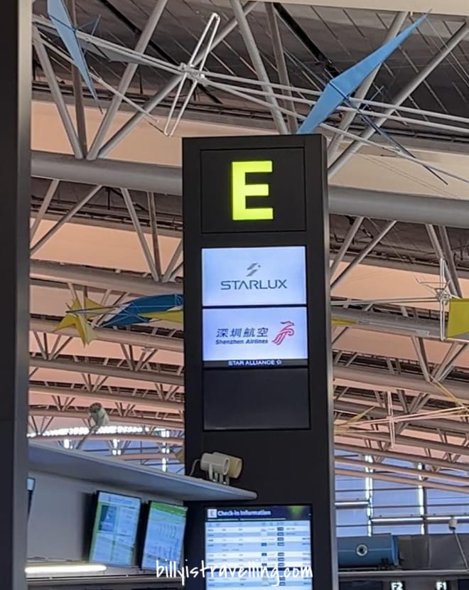 starlux airlines check-in counter at KIX T1 E island