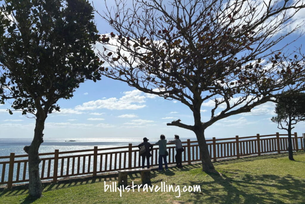 3 ladies chatting and visiting the chinen misaki park in okinawa